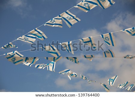 Israeli flags showing the Star of David hanging proudly for Israel\'s Independence Day (Yom Haatzmaut)