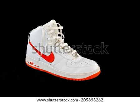 TEL AVIV, ISRAEL - JULY 20, 2014: A high-top classic Nike AF-1 Air Force 1 white and orange leather basketball shoe sneaker, isolated on black
