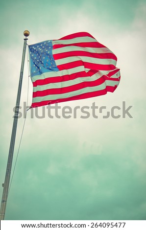 US United States Flag handing proudly over the the Liberty State Park 9/11 Memorial in New Jersey - vintage retro look