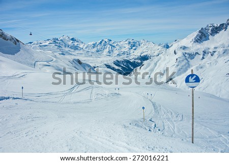 View of the pistes, ski trails, and mountains of the Lech Zurs ski resort, part of the Arlberg  ski area, from a mountainside restaurant.