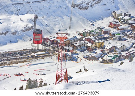 Ski gondola - cable car and a bird\'s eye view of the hamlet of Zurs and the Lech - Zurs ski resort in Arlberg, Tyrol, Austria