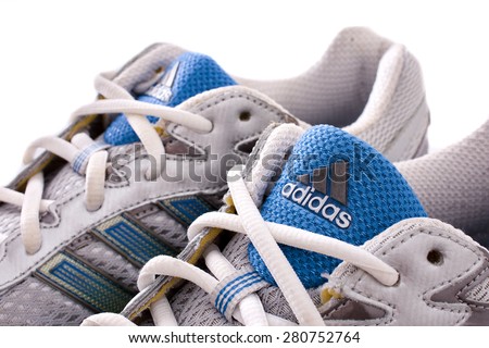 NEW YORK - May 22, 2015: Adidas running shoes - sneakers - trainers, in gray and blue, showing the Adidas logo and famous three stripes - illustrative editorial