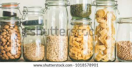 Similar – Image, Stock Photo Glass jar containers full with dried uncooked food ingredients