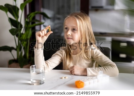 Similar – Image, Stock Photo Little Caucasian Girl in costume of which orange and black color and celebrating Halloween outdoor