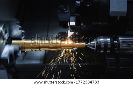 Metal machine tools industry. CNC turning machine high-speed cutting is operation.flying sparks of metalworking Stok fotoğraf © 