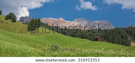 West face of Santa Croce vertical pillars, Fanes mountain group, as seen from the trail down to La Villa from Santa Croce church, Badia, Val Badia, Dolomites, Trentino, Alto Adige, South Tyrol, Italy