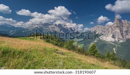 Sella mountain Group and Sassongher mountain peak as seen from Piz La Ila and La Frainas mountain plateau meadows, La Villa, Val Badia, Alta Badia, Dolomites, Trentino, Alto-Adige, South Tyro, Italy
