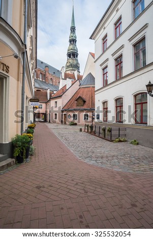 Skarnu (Butcher\'s) street, Old City of Riga, Latvia-October 2, 2015: One of the most beautiful streets in old city town - St.Peter\'s & St. George\'s churches, the oldest stone building & Konventa Seta