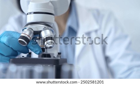 Image, Stock Photo Hand with analysis tube on blue background with copy space