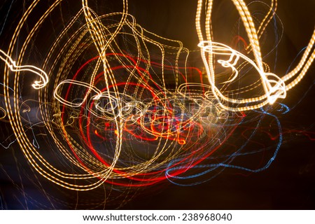 Abstract background with spiral light trails from urban lights