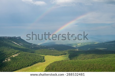 Double rainbow over Crimea mountains, view from Mangup Kale -  historic fortress and ancient cave settlement. Crimea peninsula, Russia -