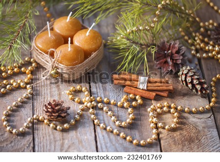 Cosy family Christmas set with candles, cinnamon, fir-tree and traditional decor.