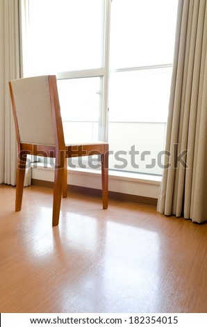 A chair beside the slide window.