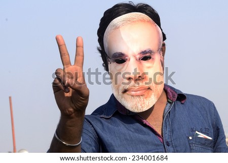 KOLKATA- FEBRUARY 02: a B.J.P. member showing victory sign during Narendra Modi\'s election rally organised by West Bengal B.J.P. at Brigade Parade ground on February 02, 2014 in Kolkata, India.