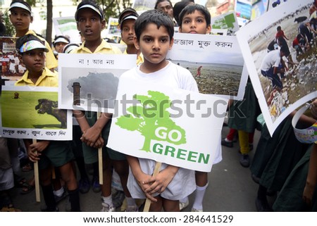 A school student with Go Green poster on occasion of World Environment Day on June 05, 2015 in Calcutta, India.