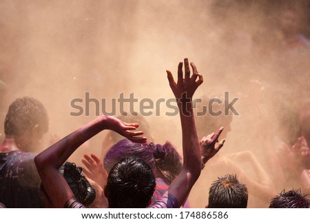 People throw colors to each other during the Holi celebration on March 27, 2013, Mumbai, Maharashtra, India. Holi is the most celebrated religious color festival in India.