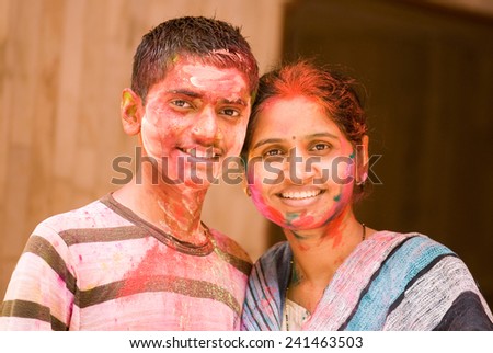 Mother and son play HOLI an Indian color festival at Mumbai Maharashtra India Asia South East Asia