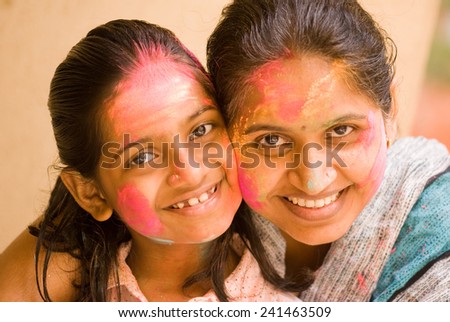 Mother and daughter play HOLI Indian color festival at Mumbai Maharashtra India Asia South East Asia