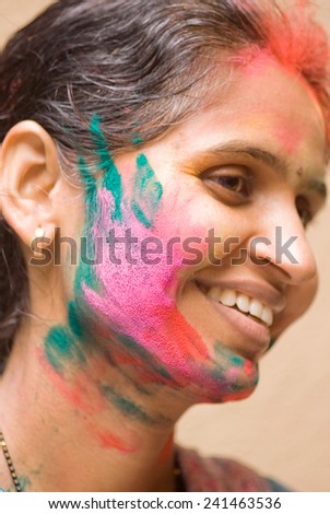 A lady play HOLI an Indian color festival at Mumbai Maharashtra India Asia South East Asia