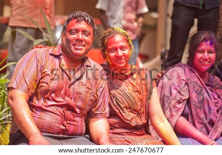 Indian Family celebrating Indian color festival called HOLI on March 17, 2014, Mumbai Maharashtra India South East Asia
