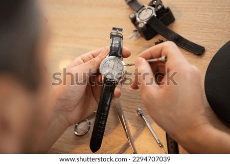 Similar – Image, Stock Photo Crop worker assembling mechanism in workshop