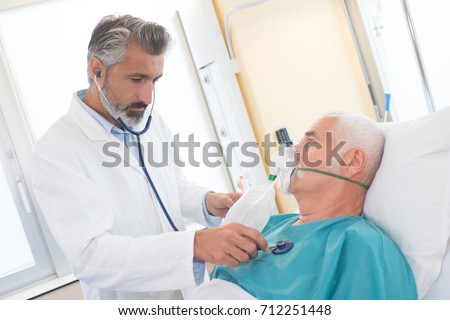 Similar – Image, Stock Photo Senior man using medical device to measure blood pressure