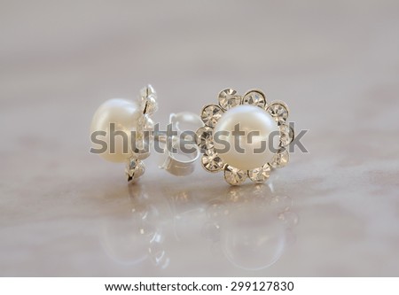 white gold earrings with pearls and diamonds