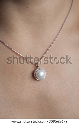 Woman\'s decollete with a luxury jewelry