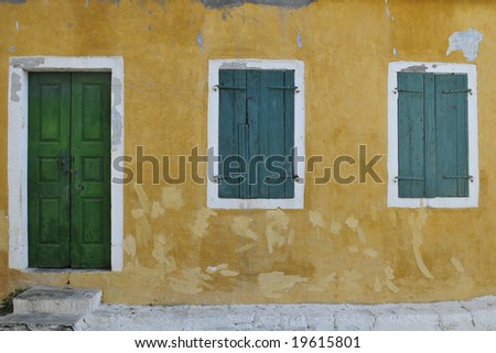 Colorful old wall with windows and door