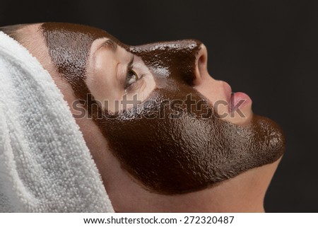 woman with a chocolate face-pack