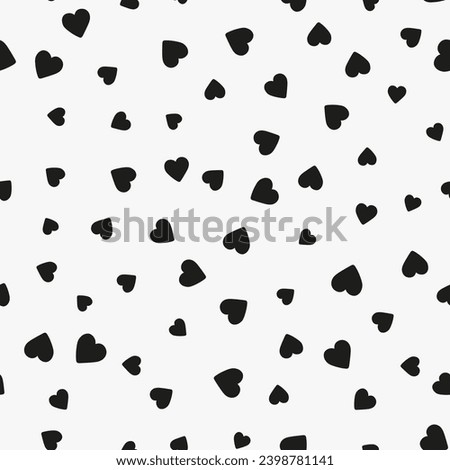 Simple minimalistic seamless pattern, black hand-drawn hearts of different sizes on a white background. Sugar sprinkles, confetti.