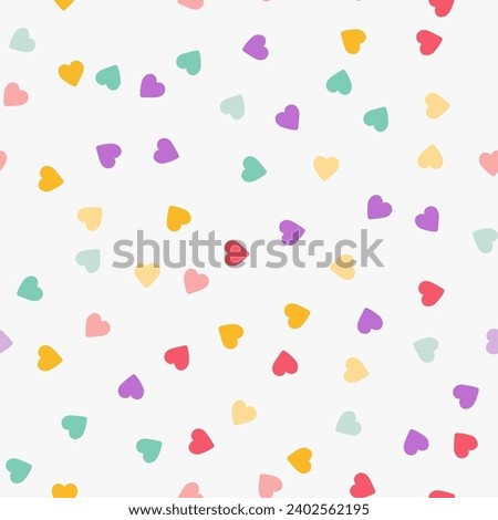 Simple minimalistic seamless pattern, playful hand-drawn cute hearts of different colors on a white background. Sugar sprinkles on a donut, romantic background, Valentine's Day.