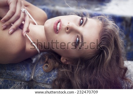Pretty young girl lying on the back