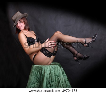 Super sexy rodeo cowgirl in black net nylons and cowboy hat