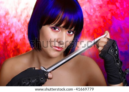 Beautiful girl with a dagger on a bloody red background. Conceptual image - revenge metaphor.