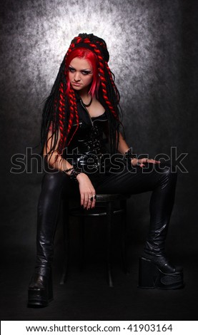 Portrait of bizarre red hair Gothic Girl. Low key studio shot. Great for calendar.