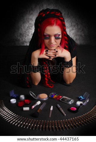 Portrait of bizarre red hair Gothic Girl with make-up. Low key studio shot. Great for calendar.