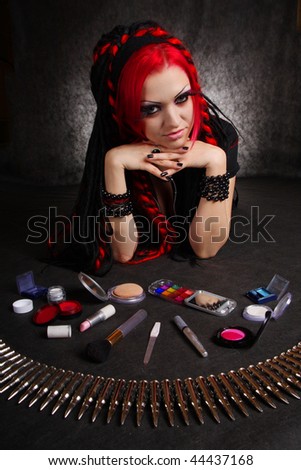 Portrait of bizarre red hair Gothic Girl with make-up. Low key studio shot. Great for calendar.