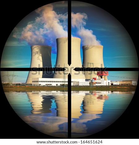 Nuclear power plant in a terrorist\'s weapon gunsight. Nuclear safety concept.