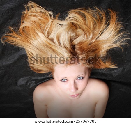 Beautiful young woman with blonde long hair
