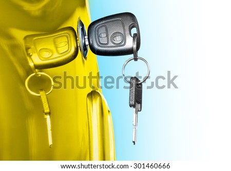 Key at car doors. Closeup with shallow DOF. Picture with space for your text.