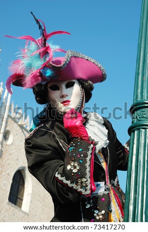 VENICE - MARCH 8: Lady in costume at St. Mark\'s Square during the Carnival of Venice on March 8, 2011.The annual carnival was held in 2011 from February 26th to March 8th