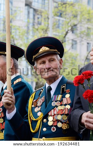 ODESSA,UKRAINE - MAY 9:Old veterans come to celebrate Victory Day at Unknown Sailor memorial in commemoration of Soviet soldiers who died during Great Patriotic War on May 9,2014 in Odessa,Ukraine