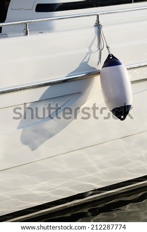 White moto boat fender,device for protecting the side of a sailing vessel as it heads into port