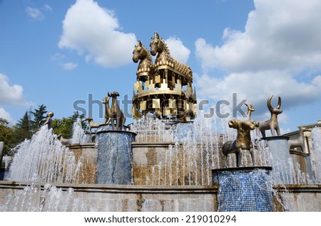 KUTAISI, GEORGIA - SEPTEMBER 5, 2014: Fountain on central square in Kutaisi, Georgia,capital of antique Colhis. Fountain shows 30 golden statues of the Colchis.