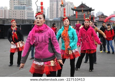 On November 1, 2014 in xi \'an ancient city wall of Ming dynasty, a group of older women played a popular dance \