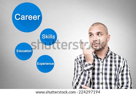 Young handsome man shows important attributes in career.