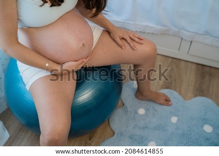 Similar – Image, Stock Photo Anonymous delicate mother sitting on floor with newborn at home