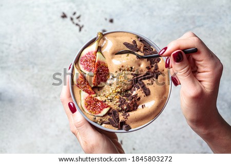 Similar – Foto Bild Leckere Frühstücksschüssel mit Quinoa, Reis und Grütze in der Nähe von Teetasse und Zeitung