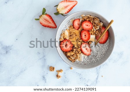 Similar – Image, Stock Photo Granola on a golden plate with a wooden spoon, rustic background